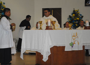 Armando prepares the altar for the Eucharist