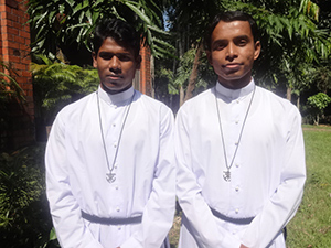 Rias Augustine Gomes, CSC, and Prodip Paul Minj, CSC, at their first profession