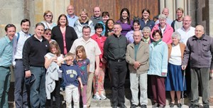 Notre Dame administrators pose for a picture along with parishioners outside of Notre-Dame de Sainte-Croix