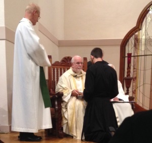 Mr Zachary Rathke, CSC, makes his First Profession to Fr O'Hara, CSC