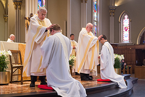 Fr Warner And Fr O'Hara Lay Hands During The Rite Of Ordination