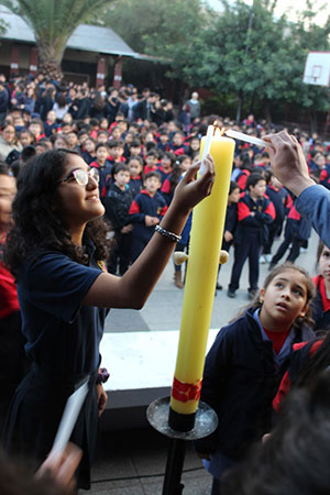 Student At Colegio Nuestra Señora De Andacollo Light Candles To Mark The Start Of The Semana San Andrés