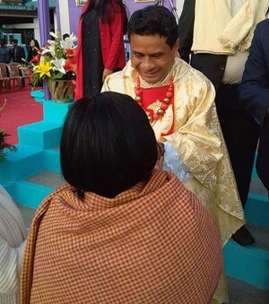 Fr Arbok receives congratulations after his Ordination