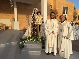 Fr David Halm, CSC, and Fr Jose Ahumada, CSC, in the sanctuary for the Papal Mass in Santiago