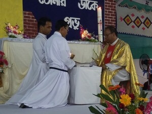 Fr James Cruze receives the Final Professions of Khokun and Bikash