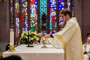 Deacon Thomas prepares the altar for the first time