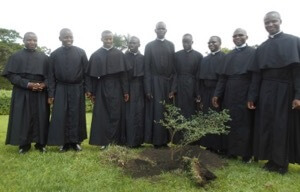 2019 Newly Professed in East Africa take a picture with the tree they planted