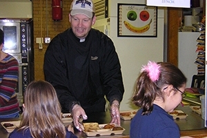 Rev Neil Wack, CSC, Serving Lunch