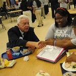 Br. Robert Fillmore, C.S.C. at lunch with students at Holy Trinity High School in the United States
