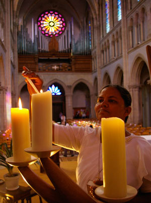 Lighting Candle at Notre-Dame de Sainte-Croix