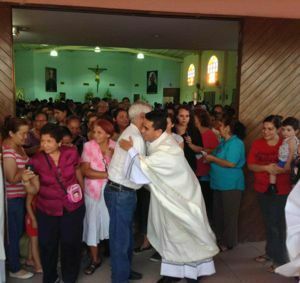 Armando greets parishioners after his Ordination