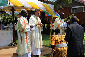Newly ordained Deacons give communion