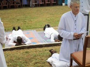 Br Chester Freel kneels with Br Biney and Br Gillette during the Litany of Saints