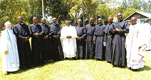 The newly professed in East Africa with (left to right) Fr Smith, Fr Amani, and Fr Mukasa