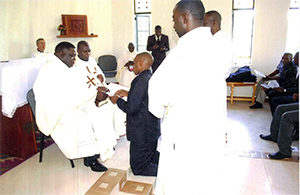 Peter Qorro, CSC, makes his First Profession to Fr Amani