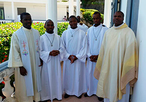 The three newly professed seminarians with Fr Ismenor (left) and Fr Louidor (right)