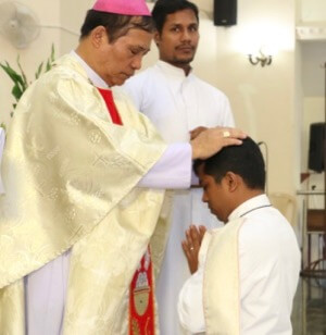 Santosh Fernandez, CSC, is ordained a deacon by Bishop Stephen Rotluanga