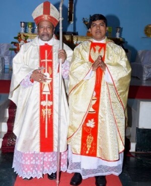 Fr Santhosh Fernandes, CSC, and the Bishop Peter Machado