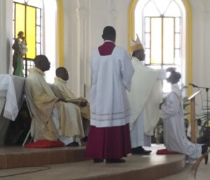 Archbishop Saturné ordains Ginal Pierre a priest