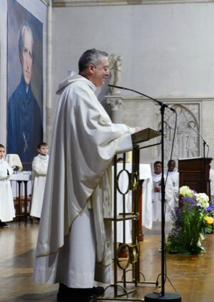 Fr John De Riso, CSC, Rector o the Shrine, speaks at the Feast Day Mass