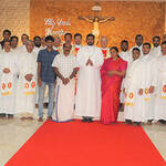 Mr. Nibin K. Cyriac, C.S.C., stands with his family after Professing his Final Vows in the South India Province.