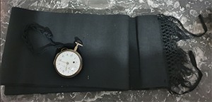 Precious relics of Fr. Dujarié's pocket watch and soutane sash