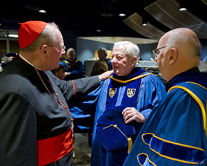 Fr Warner with Cardinal Dolan at Notre Dame graduation