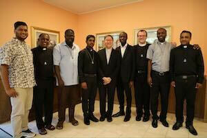 His Eminence Luis Cardinal Tagle with the eight Holy Cross missionaries to Papua New Guinea