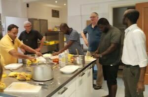 PNG Missionaries prepare traditional food with Br Ken McDonald