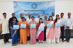 Fr. Shiju Joseph, C.S.C. with graduates