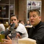 Fr. Steve Wilbricht, C.S.C. having lunch with students at Stonehill College in the United States